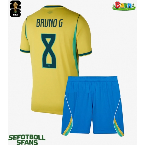 Brasilien Bruno Guimaraes #8 Hemmaställ Barn VM 2026 Kortärmad (+ Korta byxor) Brasilien Bruno Guimaraes #8 Hemmaställ Barn VM 2026 Kortärmad (+ Korta byxor)